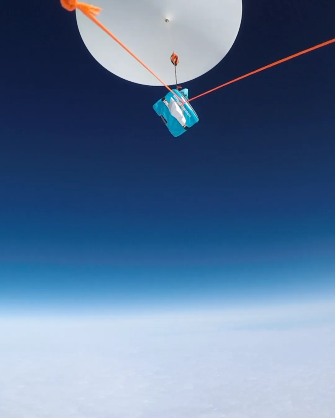 A StratoStar payload carrying a space component in near-space flight beneath the balloon